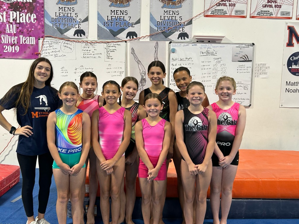 Amber Lennox with her Xcel team