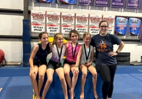 Grace Fallon with gymnasts