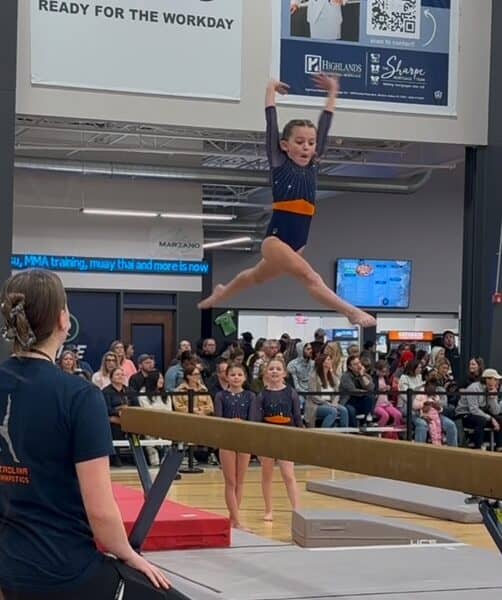 Gymnast on uneven bars