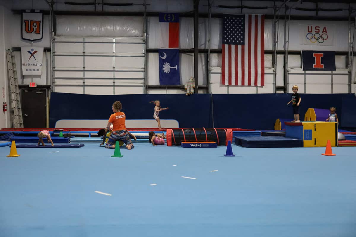 Preschool gymnast on bars